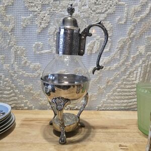 Ornate Silver-Tone Glass Pitcher with Decorative Stand